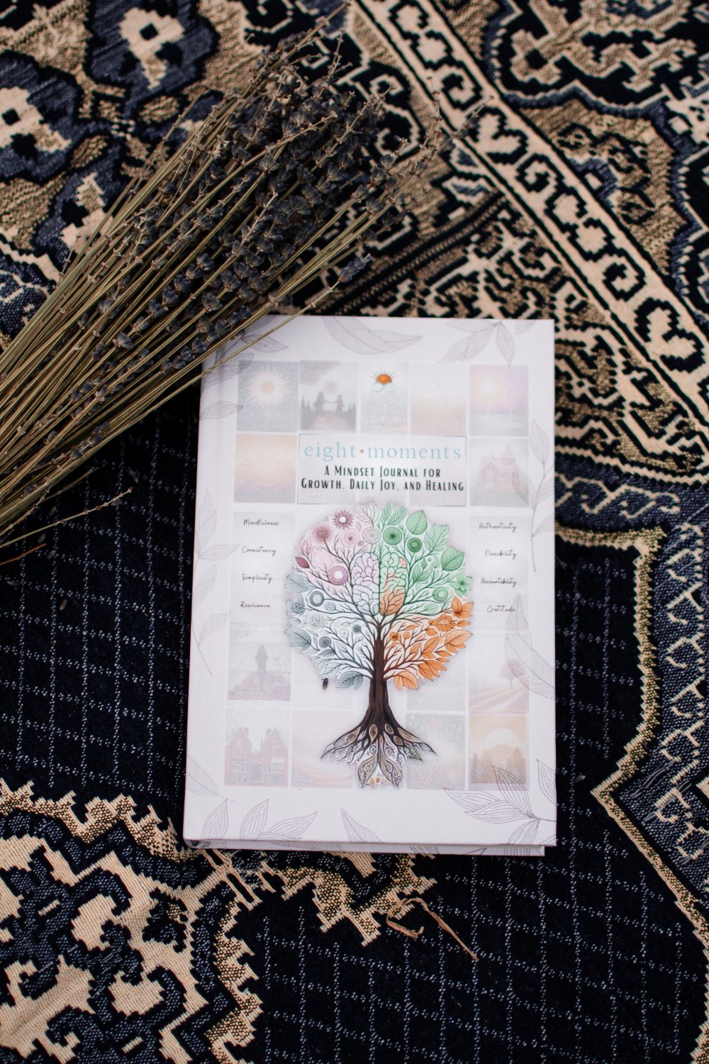 The journal on a picnic mat beside a bundle of dried lavender