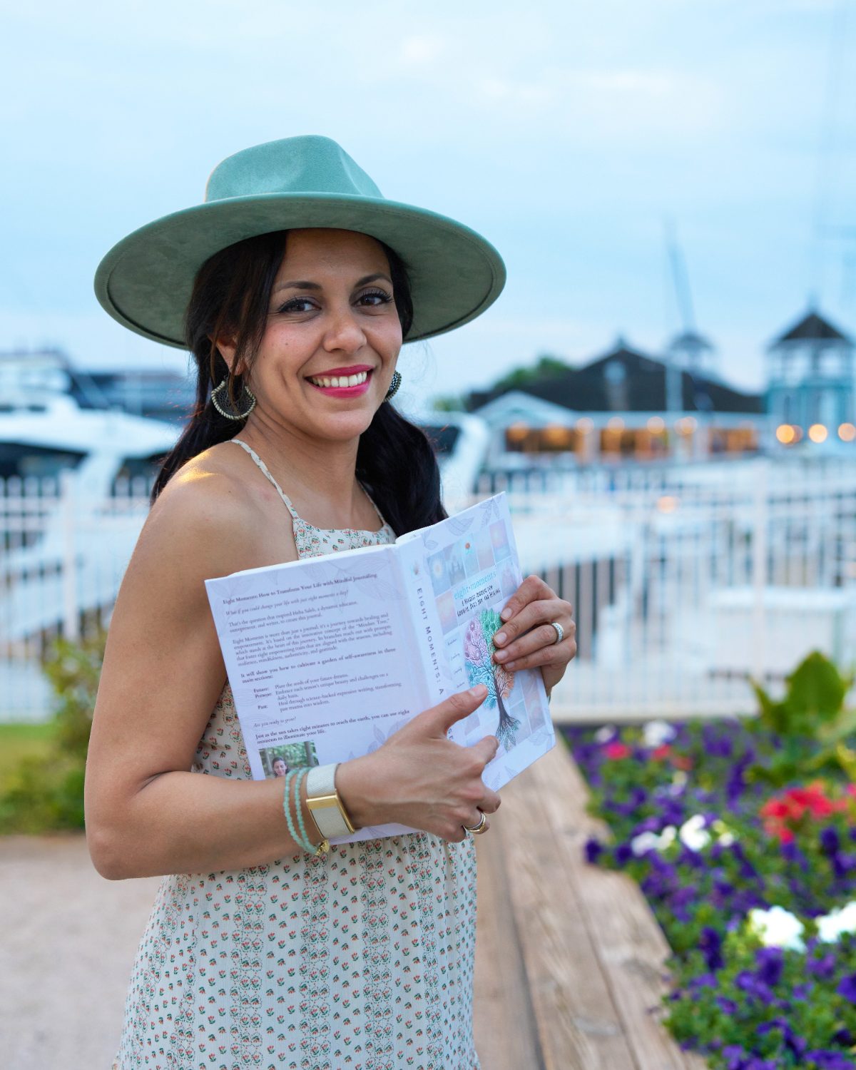 Heba hugging the journal close by the marina