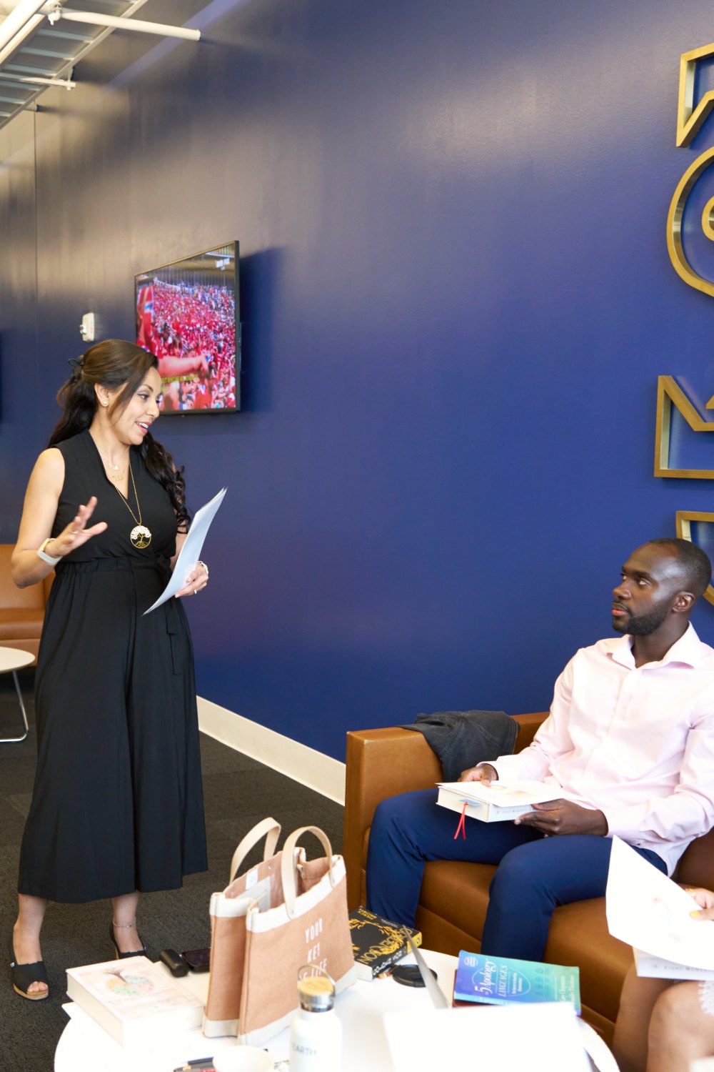Heba guiding a client through a reflection with the Eight Moments journal